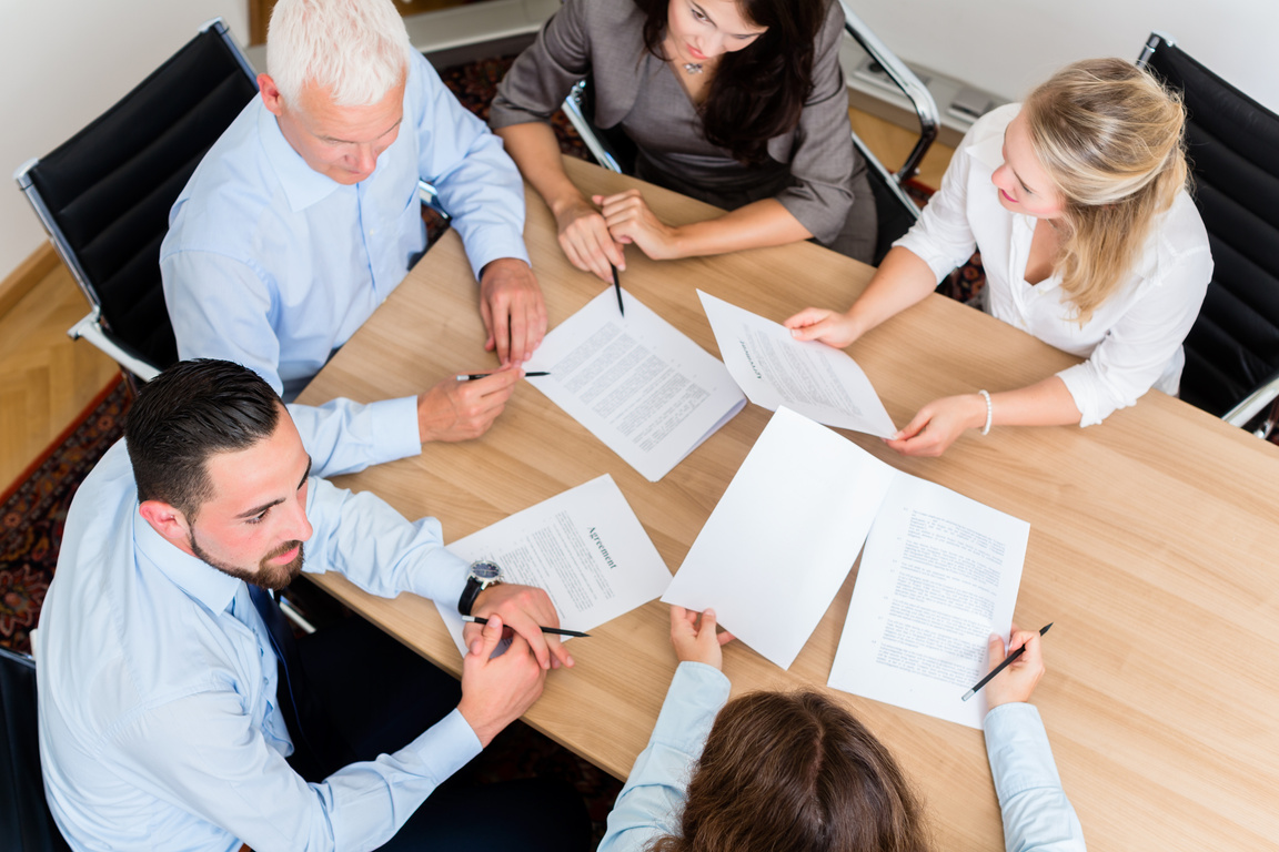 Lawyers Having Team Meeting in Law Firm